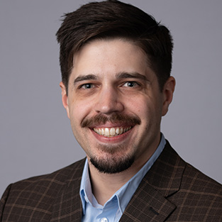 a picture of Brendan West smiling